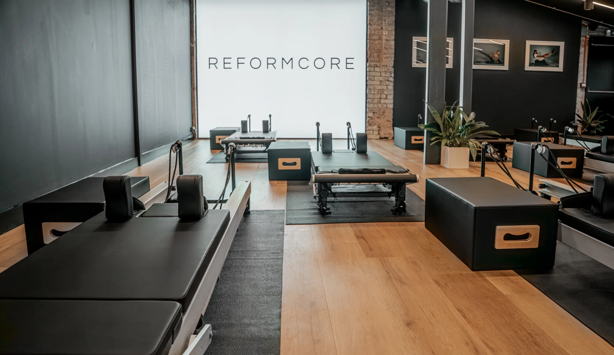 Interior of the Reformcore studio featuring state-of-the-art Reformers, minimalist design, and a premium Pilates environment focused on strength, control, and elegance.